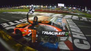 NASCAR driver crossing the finish line